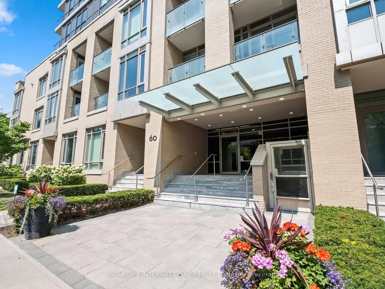 Light-stone mid-rise condominium with balconies, a glass entrance canopy and flower planters at 60 Berwick Avenue, Toronto, Ontario
